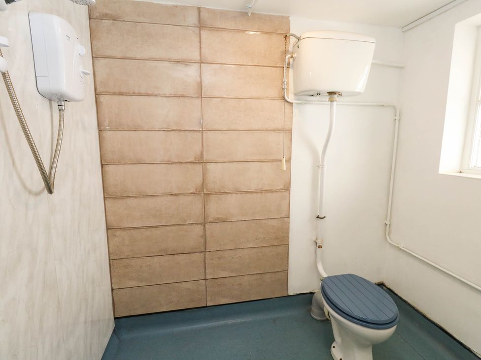 A bathroom with a toilet and a shower at The Watch House in Weymouth