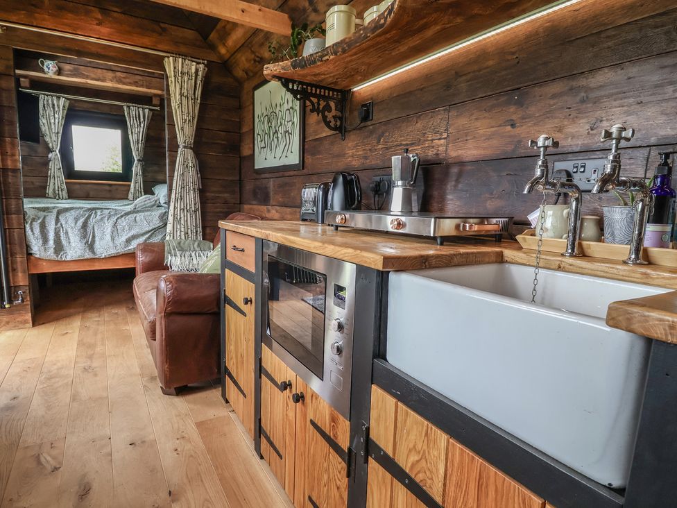 A kitchen with sink and appliances at Cloud Cabin