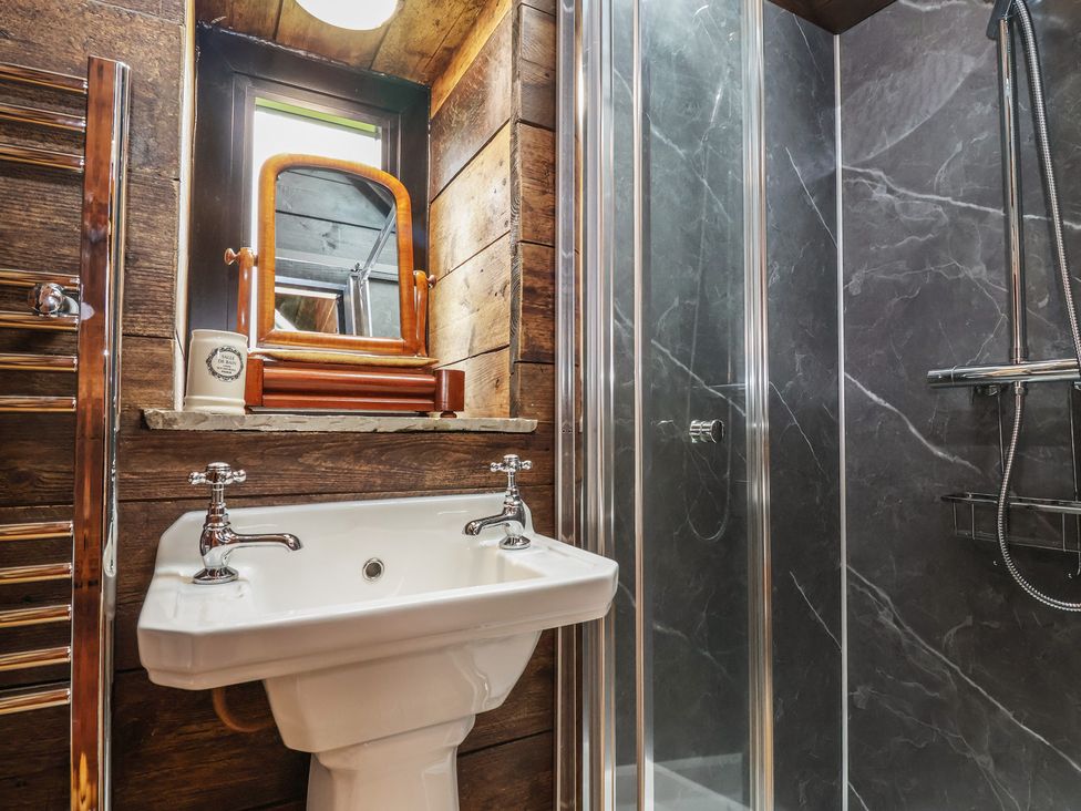 A bathroom with a sink and shower at Cloud Cabin