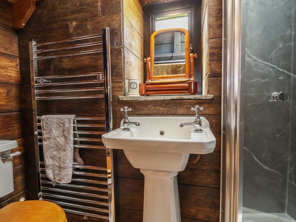 A bathroom with a sink and mirror at Cloud Cabin