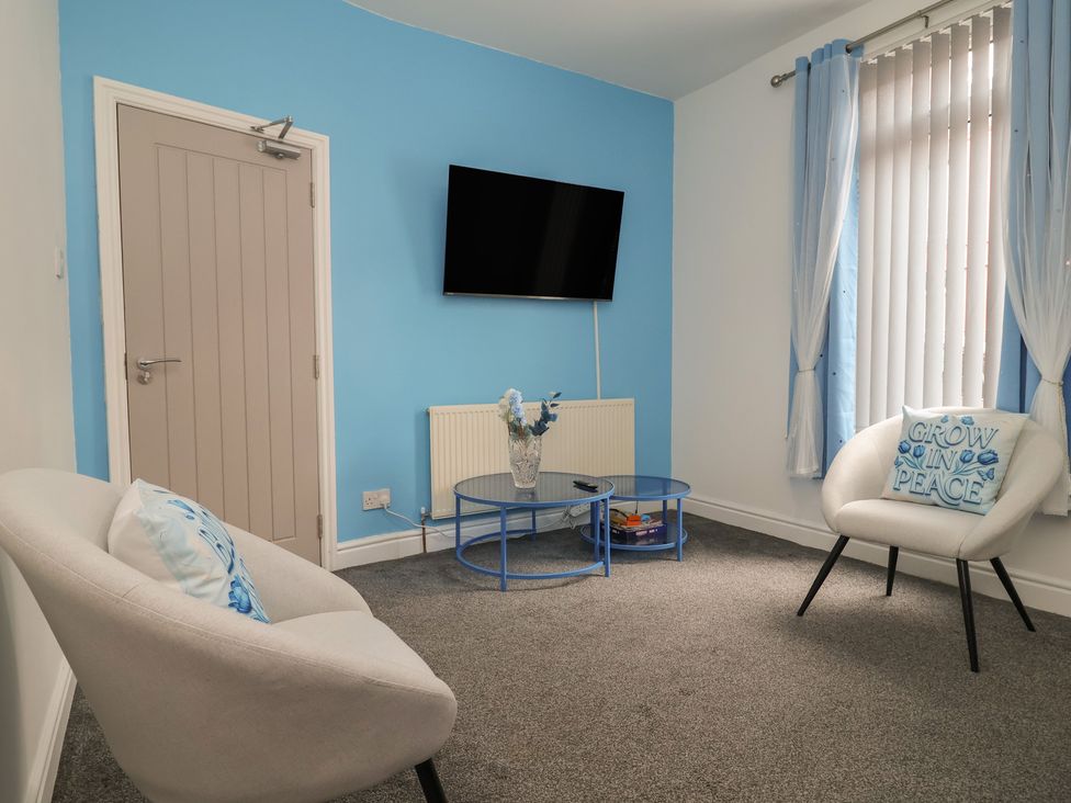 A living room with a TV and a coffee table at Lunt Road in Bootle