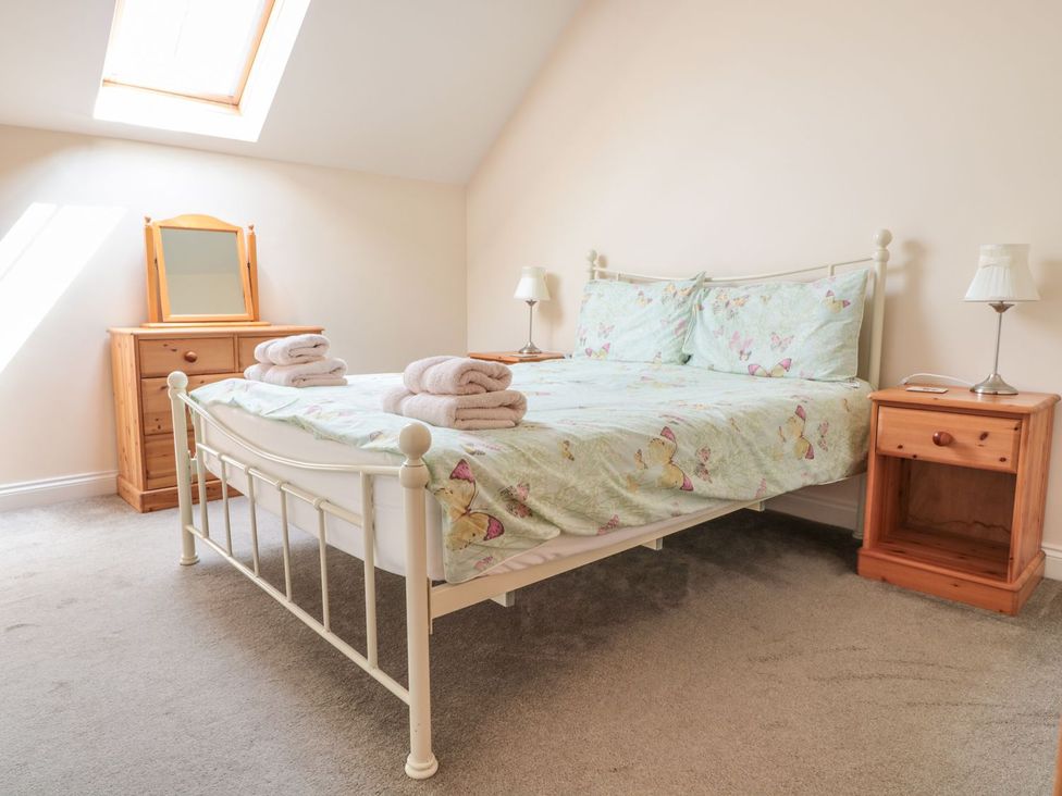 A bedroom with a bed and furniture at The Hop Kiln in Tenbury Wells