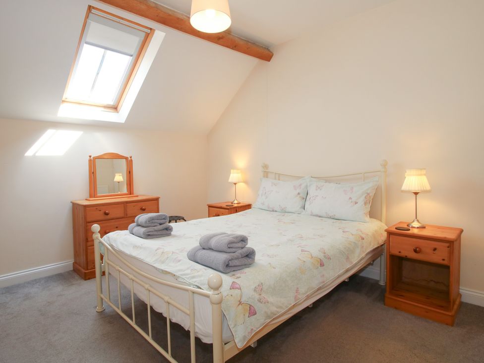 A bedroom with a bed and furniture at The Hop Kiln Tenbury Wells