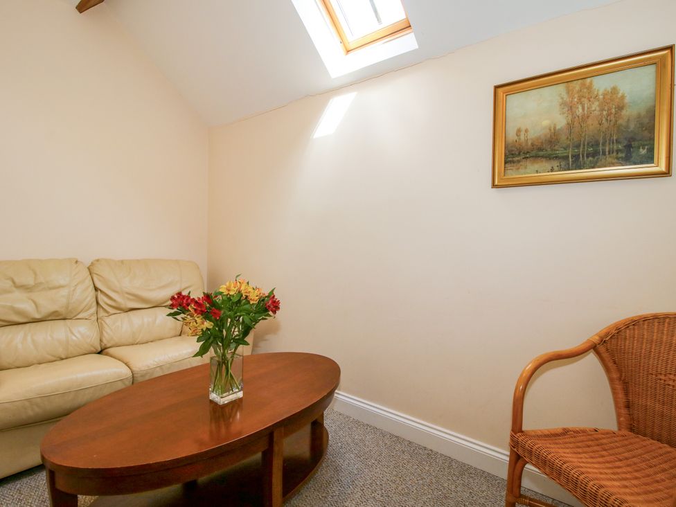 A living room with a coffee table and a sofa at The Hop Kiln in Tenbury Wells