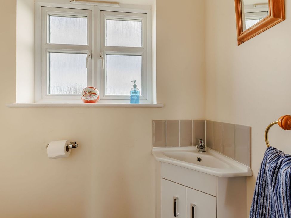A bathroom featuring a sink and a window at Wood Cottage in Tenbury Wells