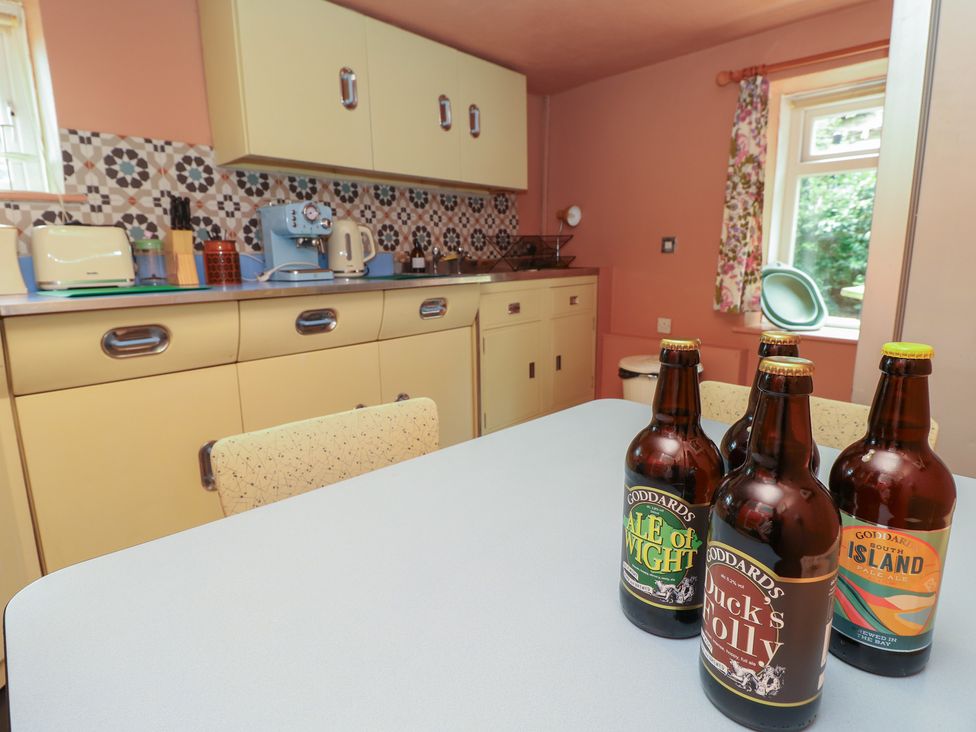 A kitchen with a countertop and various appliances at Dairy Cottage Whitwell near Niton
