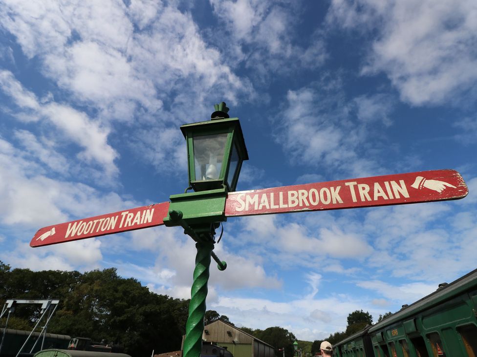 A signpost indicating Wootton Train and Smallbrook Train at Dairy Cottage Whitwell near Niton