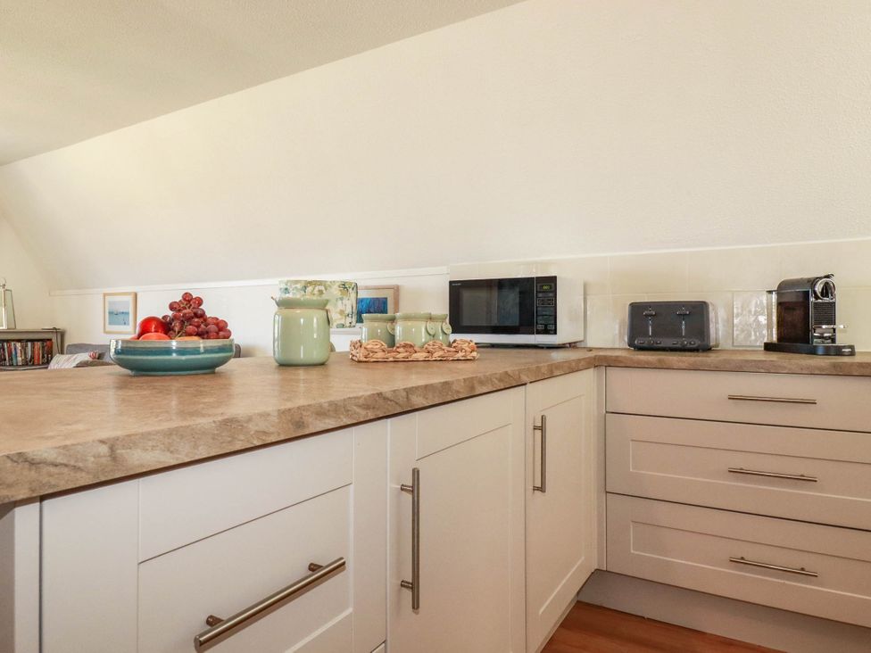A kitchen with countertop appliances and fruit bowl at Coombe Lodge No 9 in Bude