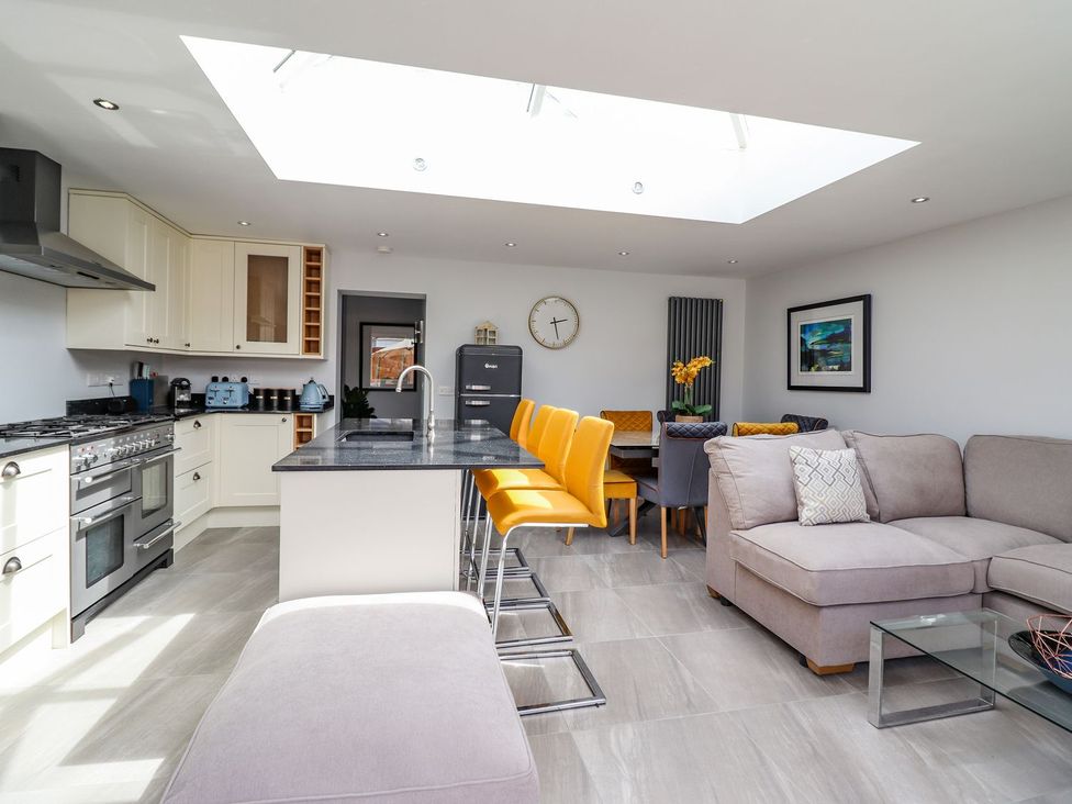 A kitchen with a dining area at Trefin Cemaes Bay