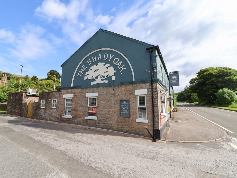 A building with a sign outside at The Old Shady Oak Cottage in High Peak