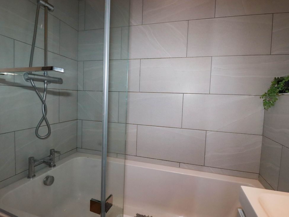 A bathroom with a bathtub and shower at Studio Room No.2 in Newquay
