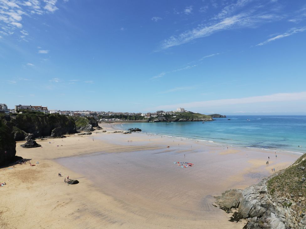 A beach with sand and water at Shoreline Apartment No.8 in Newquay