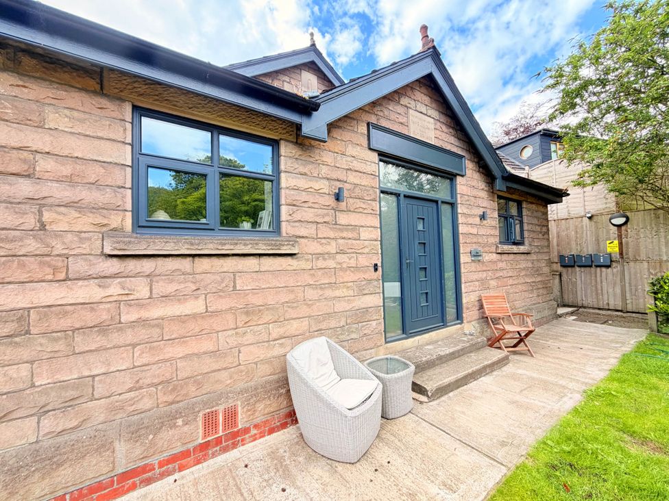 A house exterior with a front door, windows, and pathway at Stunning Retreat in the Heart of Matlock Bath Matlock Bath near Matlock