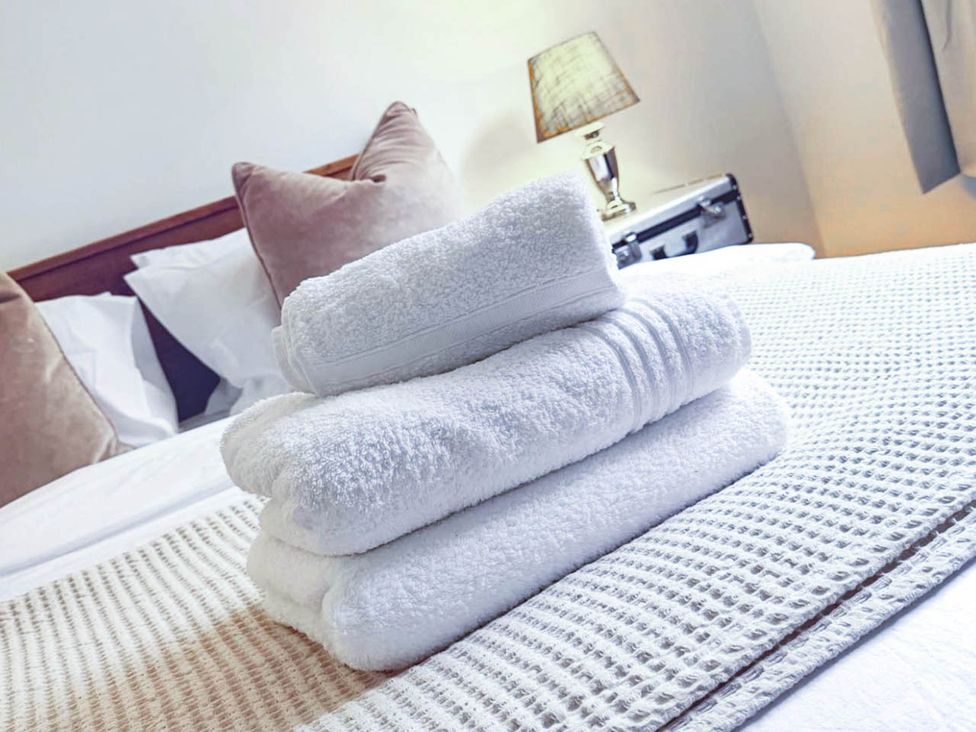 A stack of towels on a bed at Stunning Retreat in the Heart of Matlock Bath near Matlock