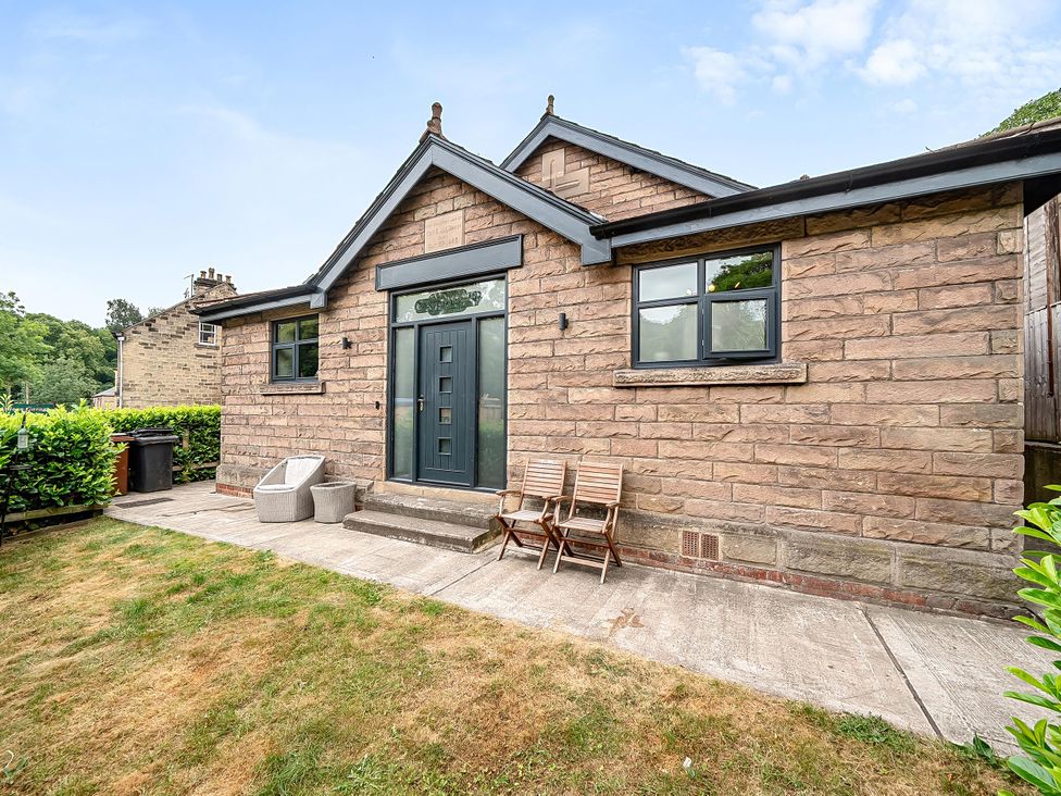 An outdoor view of a house with a door and windows at Stunning Retreat in the Heart of Matlock Bath near Matlock