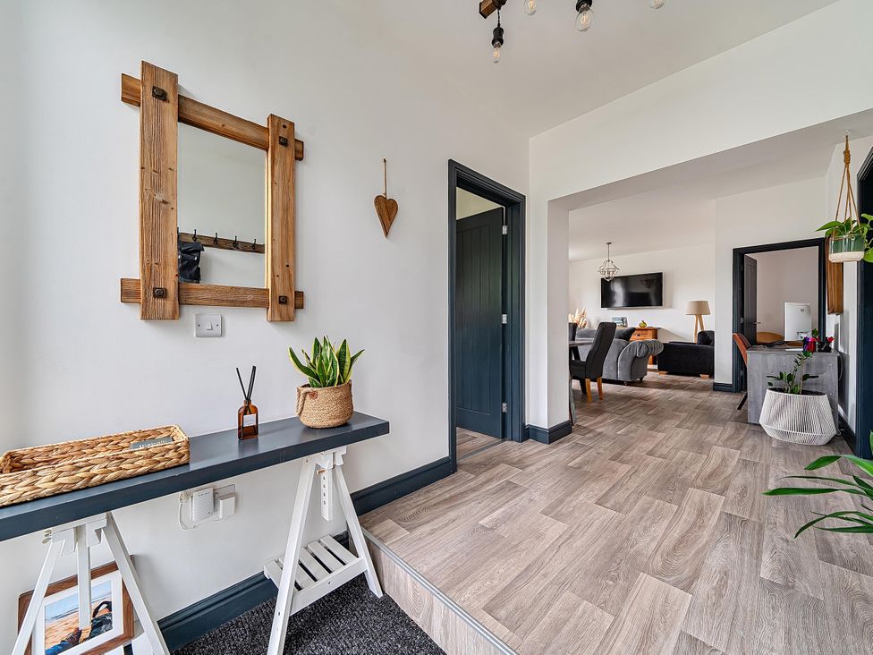 A hallway with a mirror and console table at Stunning Retreat in the Heart of Matlock Bath, Matlock Bath near Matlock