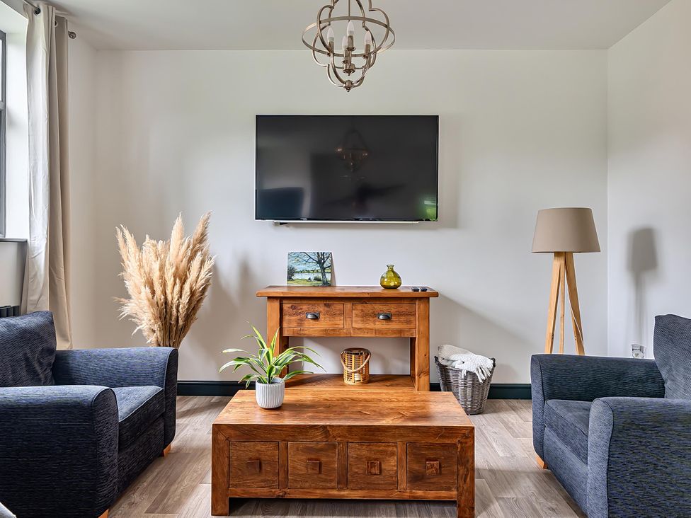 A living room with a sofa and coffee table at Stunning Retreat in the Heart of Matlock Bath near Matlock