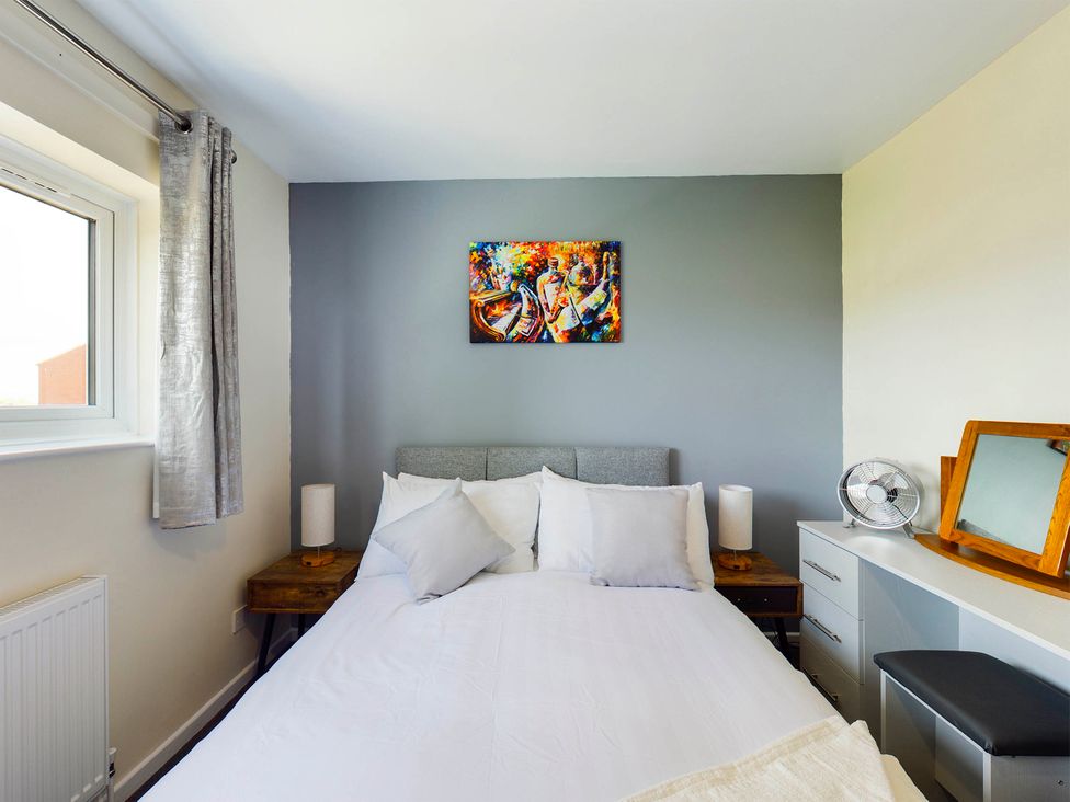 A bedroom with a bed and desk at Tranquil Telford Retreat - 3 Bedroom House Telford