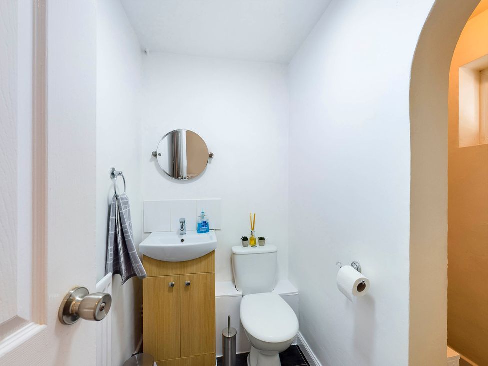A bathroom with a sink and toilet at Tranquil Telford Retreat - 3 Bedroom House in Telford