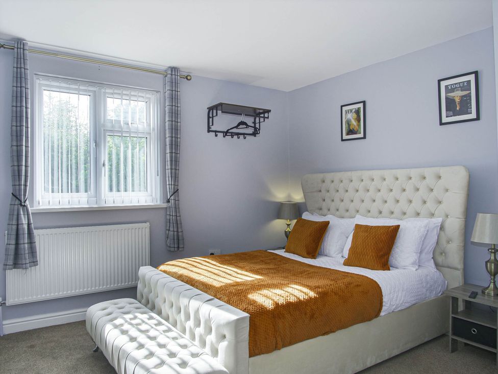 A bedroom with a bed and a window at Cozy Riverside Retreat in Snodland
