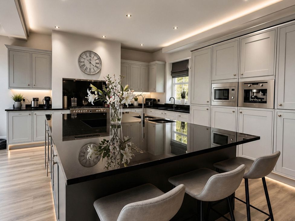 A kitchen with an island and appliances at Chowdene Lodge Estate 