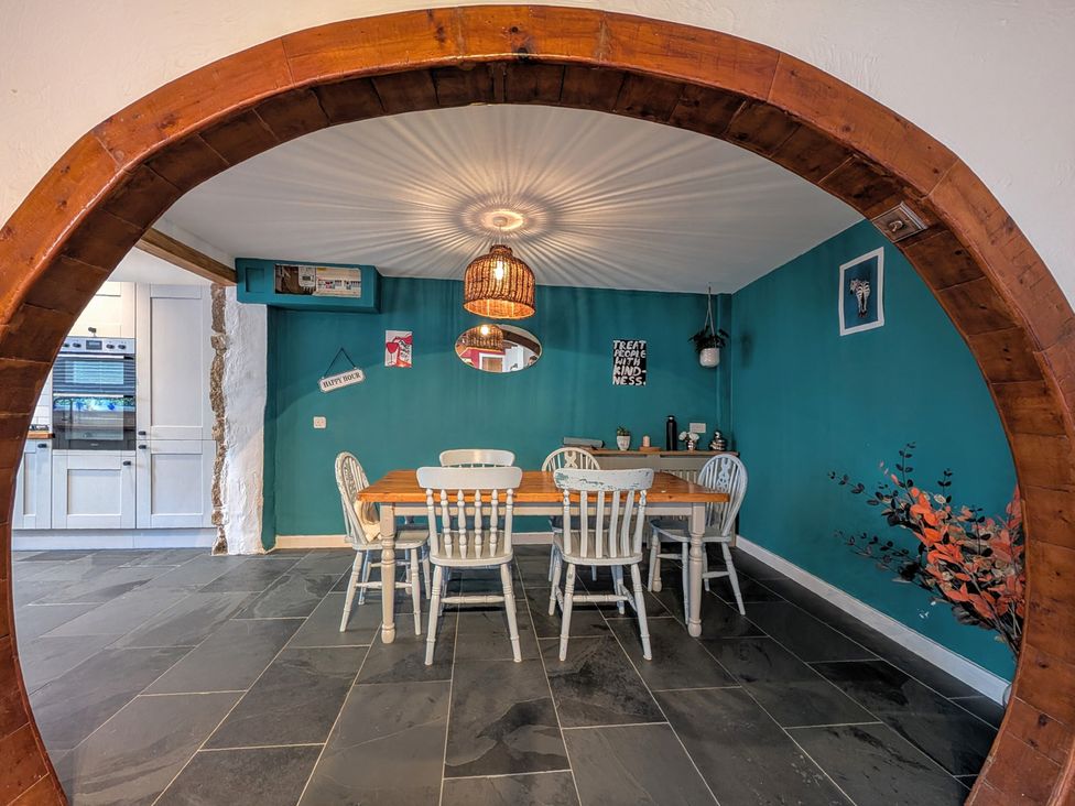 A dining room with a table and chairs at The Old Barn near St Ives Rustic Charm Space, Lelant