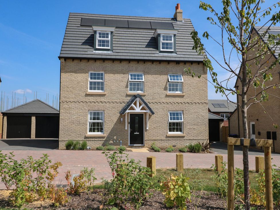 A three-story house with a garage and garden at No.6 Beck Crescent in Ashbourne