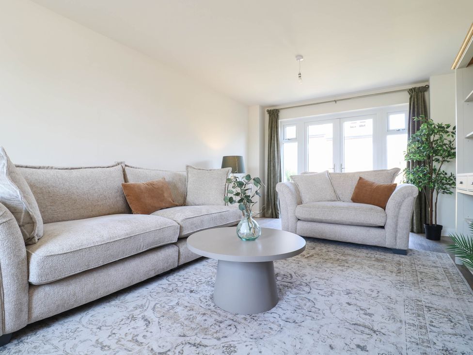 A living room with sofa and coffee table at No.6 Beck Crescent Ashbourne