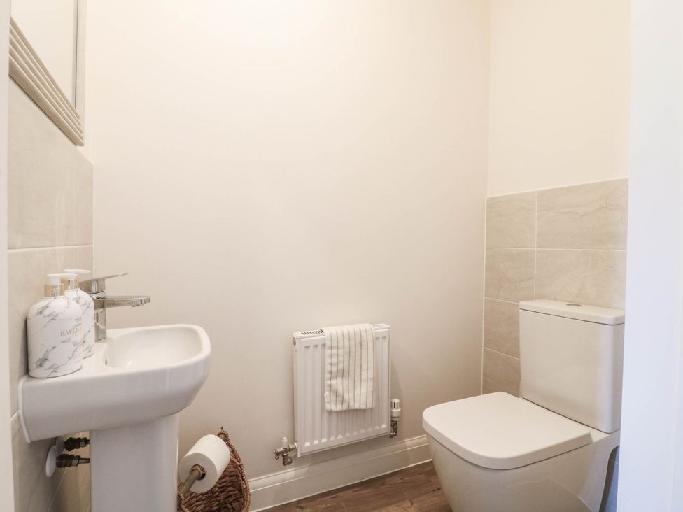 A bathroom with a sink and toilet at No.6 Beck Crescent Ashbourne