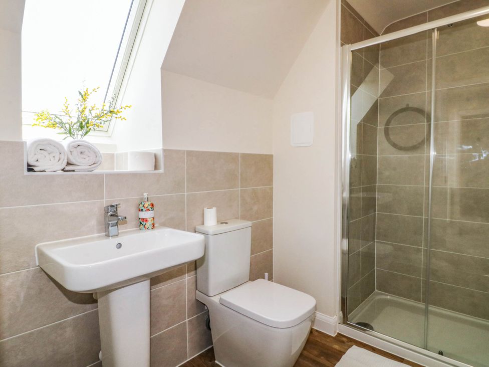 A bathroom with a sink and shower at No.6 Beck Crescent Ashbourne