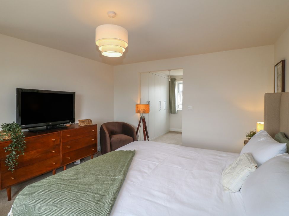 A bedroom with a bed and a dresser at No.6 Beck Crescent Ashbourne