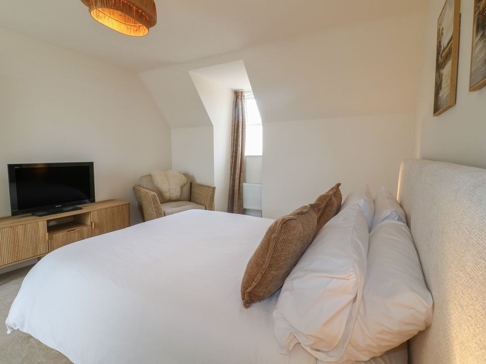 A bedroom with a bed and television at No.6 Beck Crescent, Ashbourne