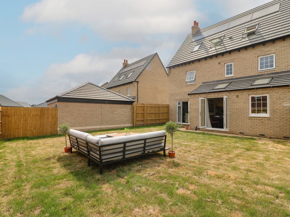 A garden with a couch and fence at No.6 Beck Crescent Ashbourne