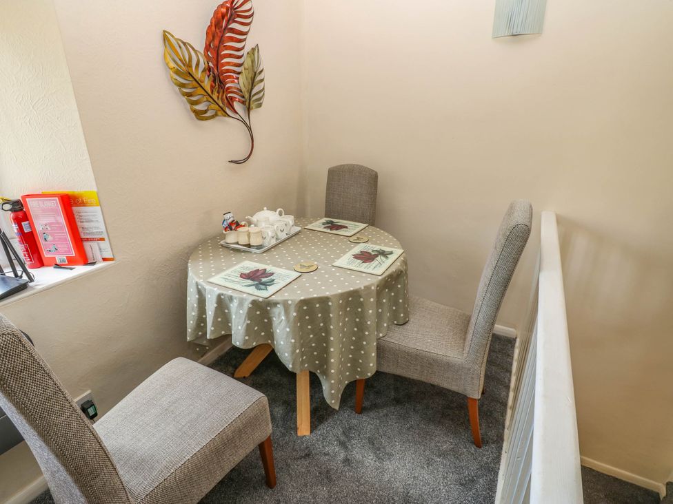 A dining area with a table and chairs at Kernot Cottage in Reeth