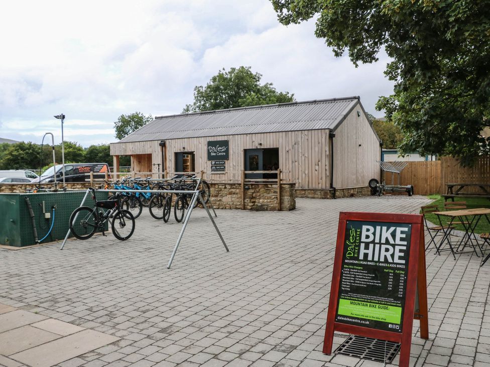 An outdoor bike hire area with bicycles at Dales Bike Centre in Yorkshire Dales