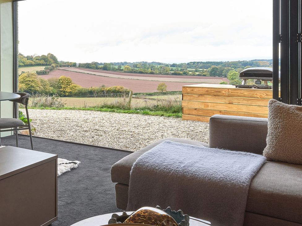 A living room with a view of the landscape at Providence Cottage Trellech