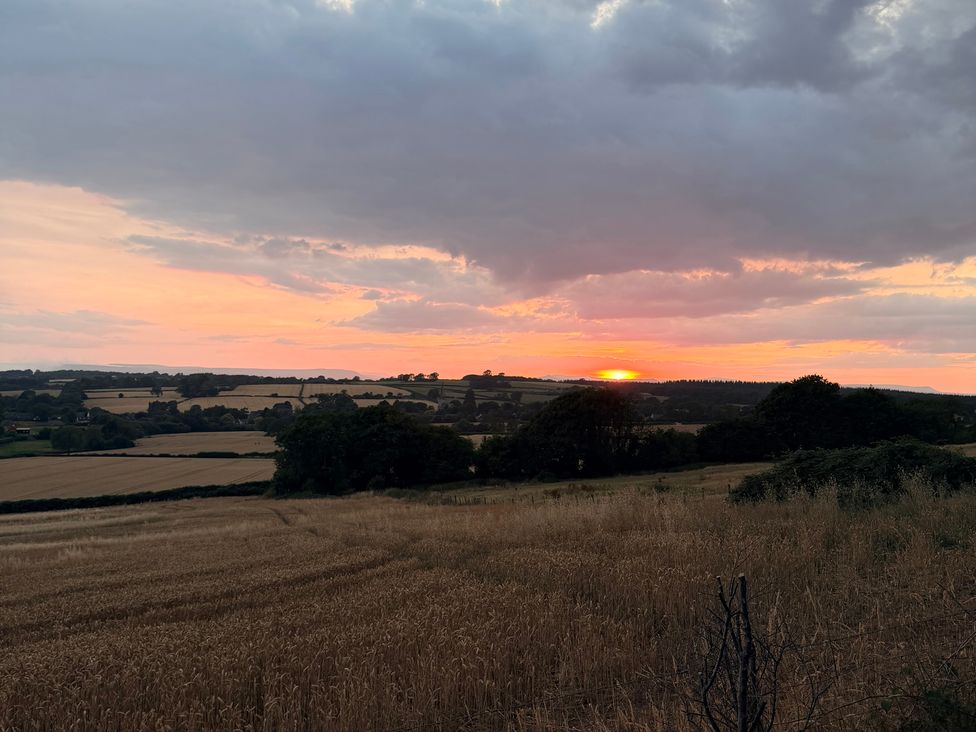 A landscape with sunset over fields at Providence Cottage in Trellech