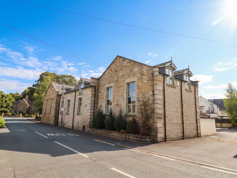 A building on a street with trees and clear sky at 4 Church Hall Mews in Garstang