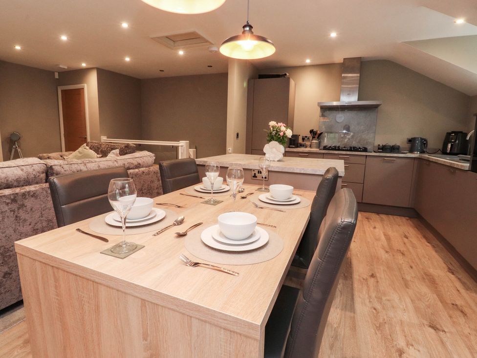 A dining area with a table set for meals at 4 Church Hall Mews, Garstang