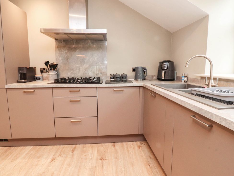A kitchen with appliances and countertop at 4 Church Hall Mews Garstang