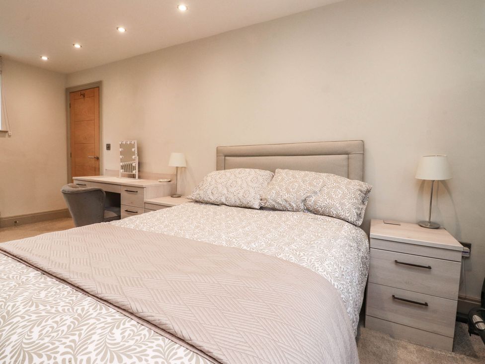 A bedroom with a bed and desk at 4 Church Hall Mews Garstang