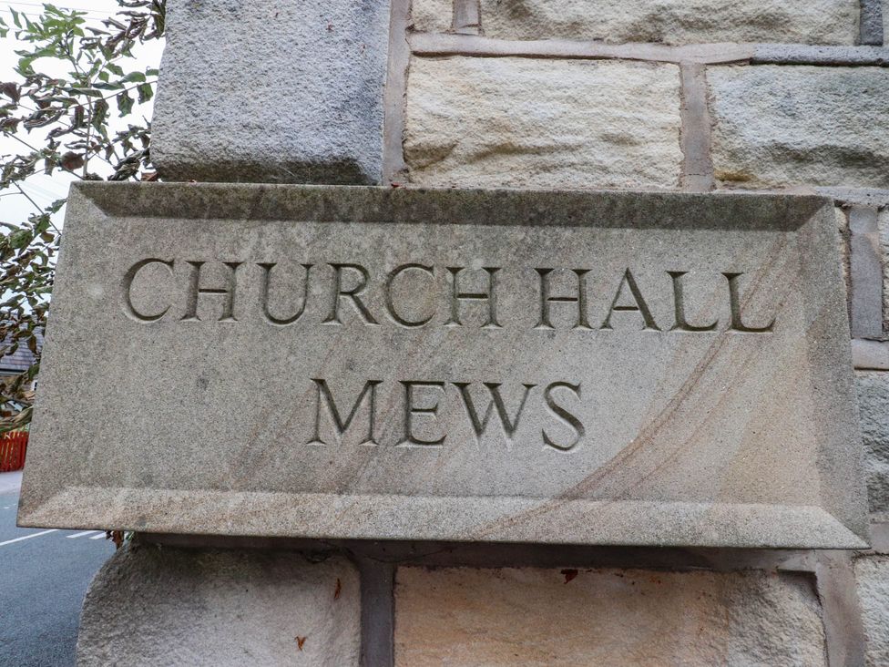 A stone sign displaying 'Church Hall Mews' at 4 Church Hall Mews in Garstang