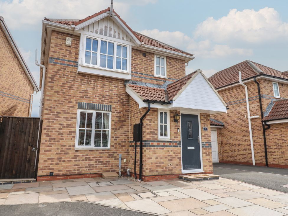 A house exterior with brick walls and a pathway at 4 Murrayfields Newcastle upon Tyne