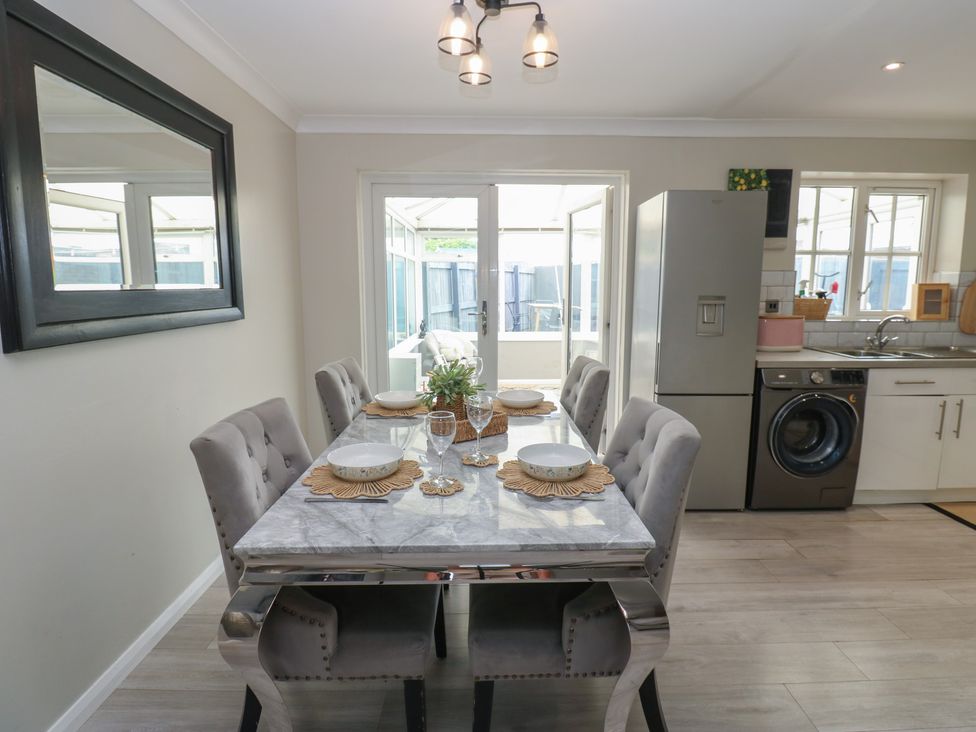 A dining room with a table and chairs at 4 Murrayfields Newcastle upon Tyne