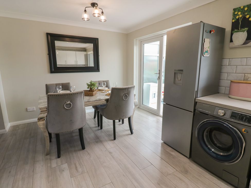 A dining area with a table and chairs at 4 Murrayfields Newcastle upon Tyne