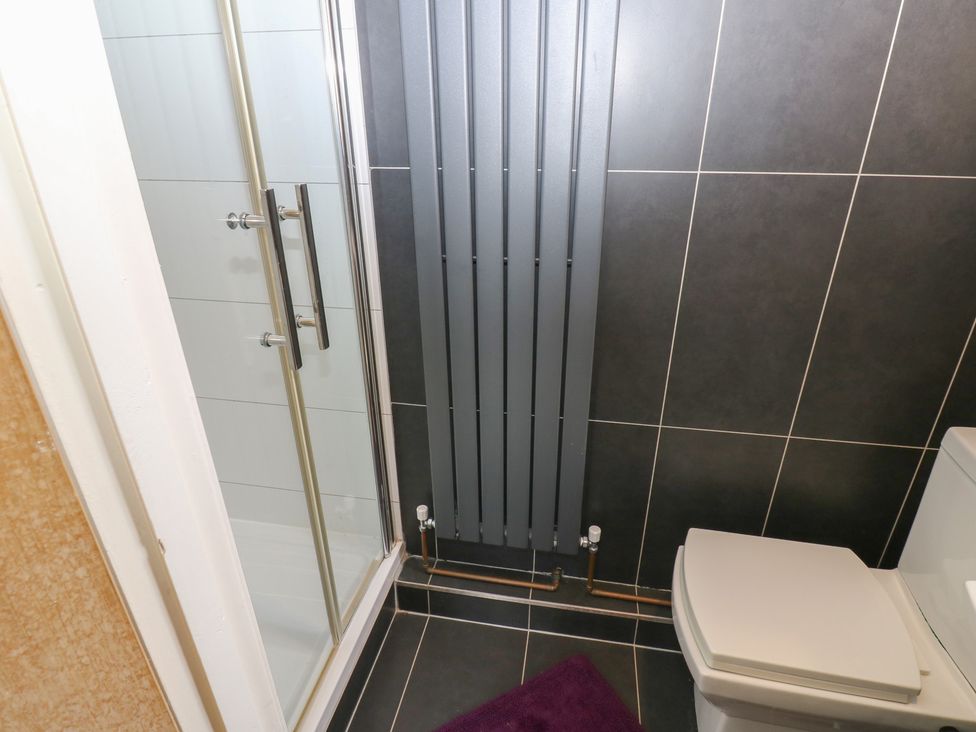A bathroom with a shower and toilet at 4 Murrayfields Newcastle upon Tyne