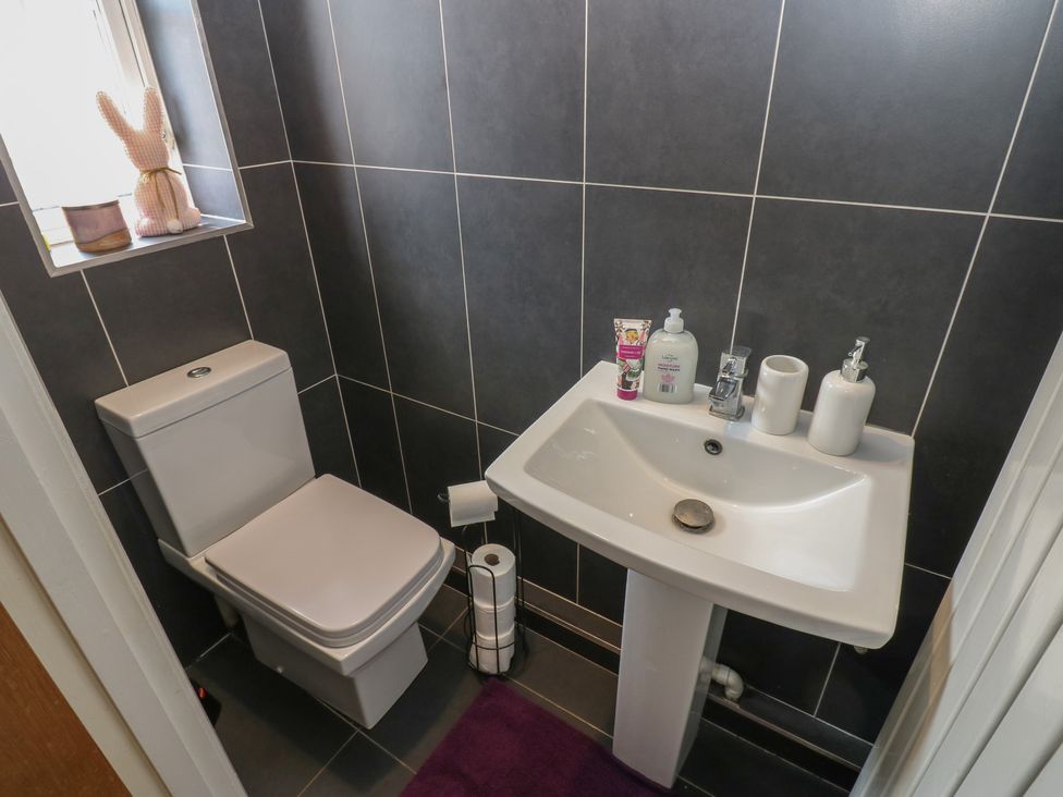 A bathroom with a toilet and sink at 4 Murrayfields Newcastle upon Tyne