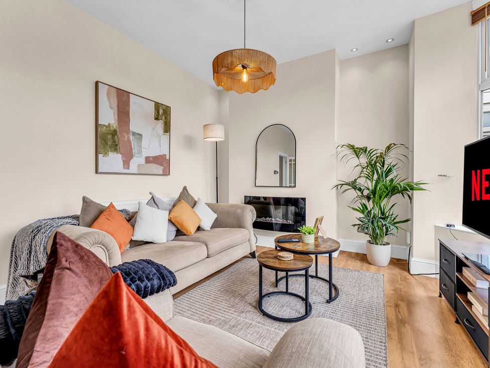 A living room with a sofa and coffee table at Peak View Terrace