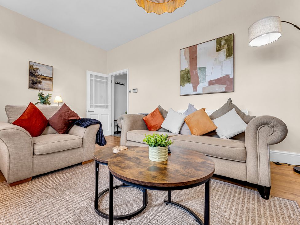 A living room with sofas and a coffee table at Peak View Terrace