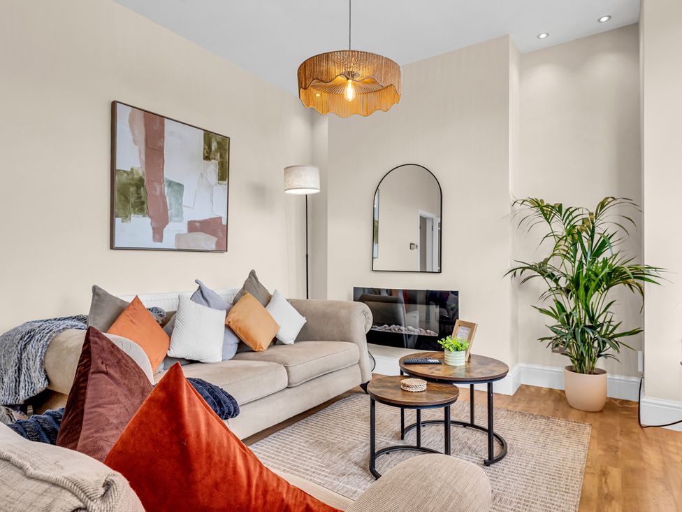 A living room with a sofa and coffee table at Peak View Terrace